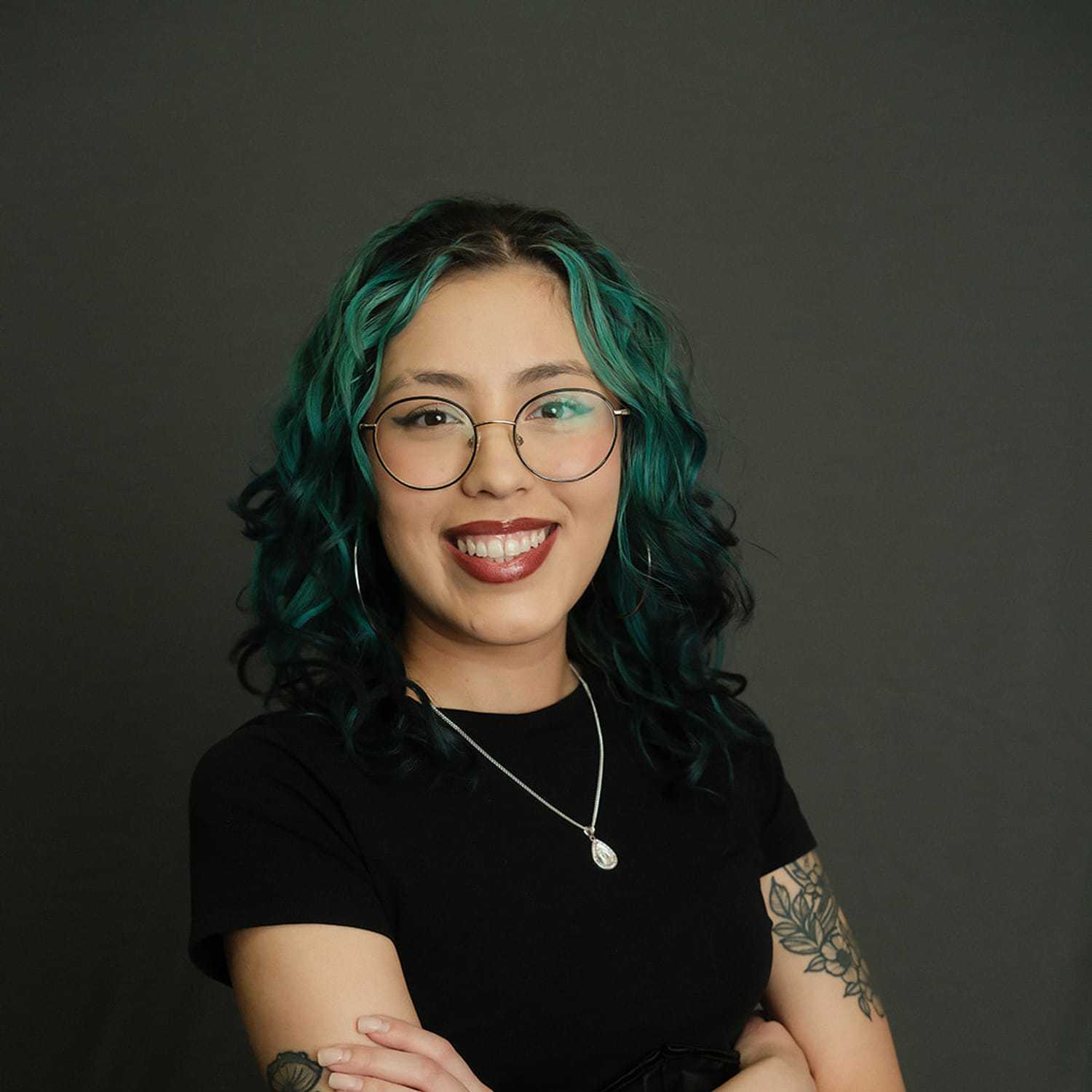 Portrait of Nina, a professional stylist at Frank Gironda  Salons, showcasing their expertise and style.