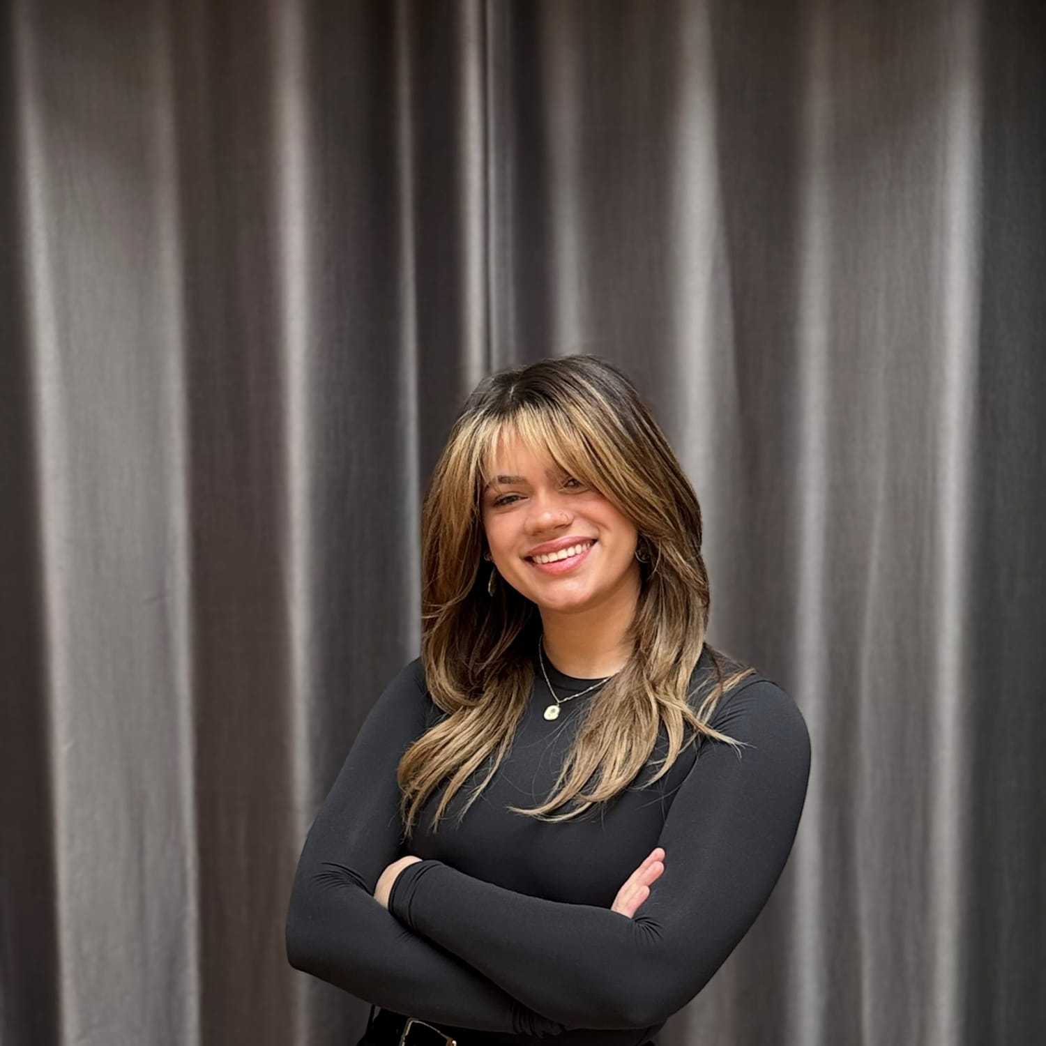 Portrait of Keila, a professional stylist at Frank Gironda  Salons, showcasing their expertise and style.