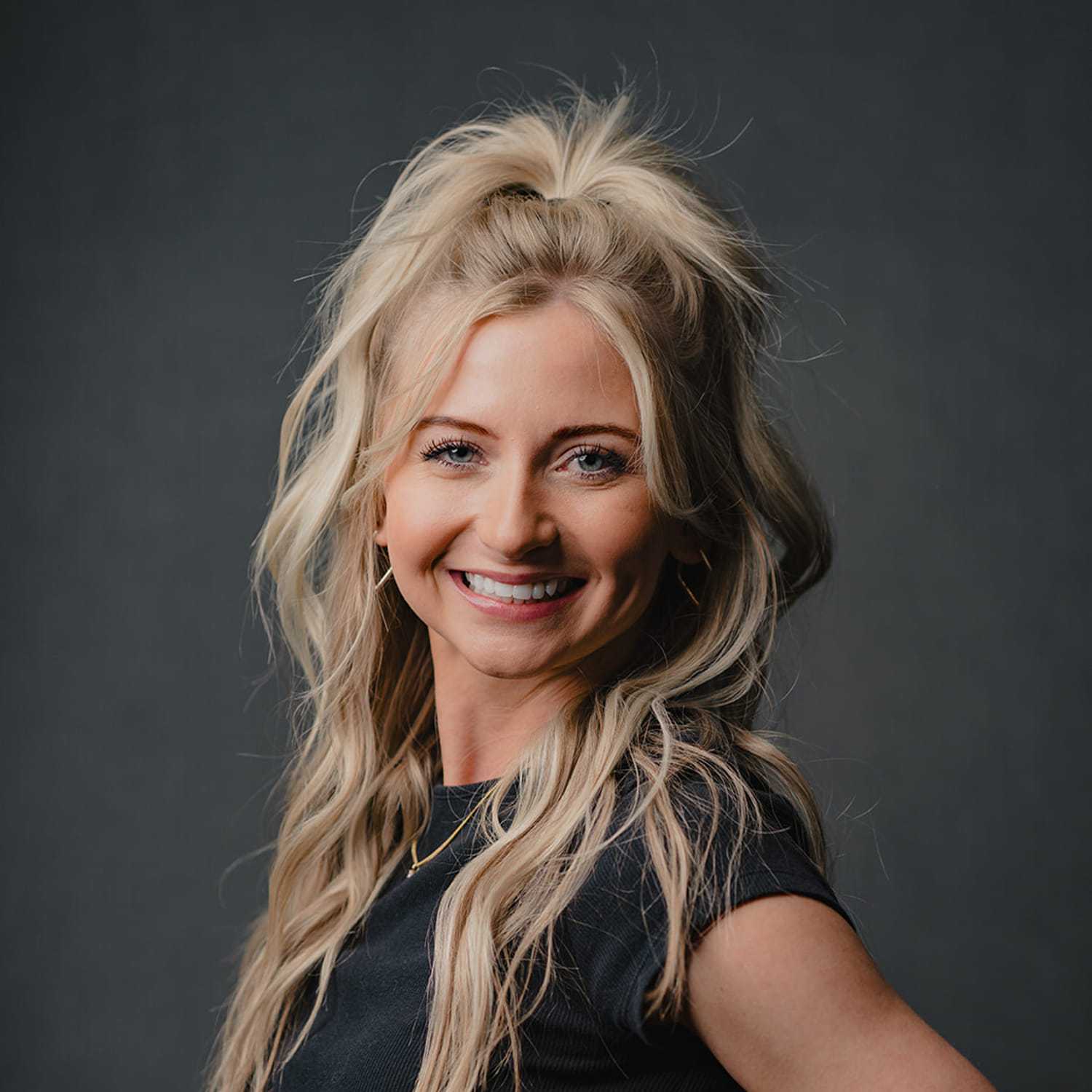 Portrait of Makayla, a professional stylist at Frank Gironda  Salons, showcasing their expertise and style.