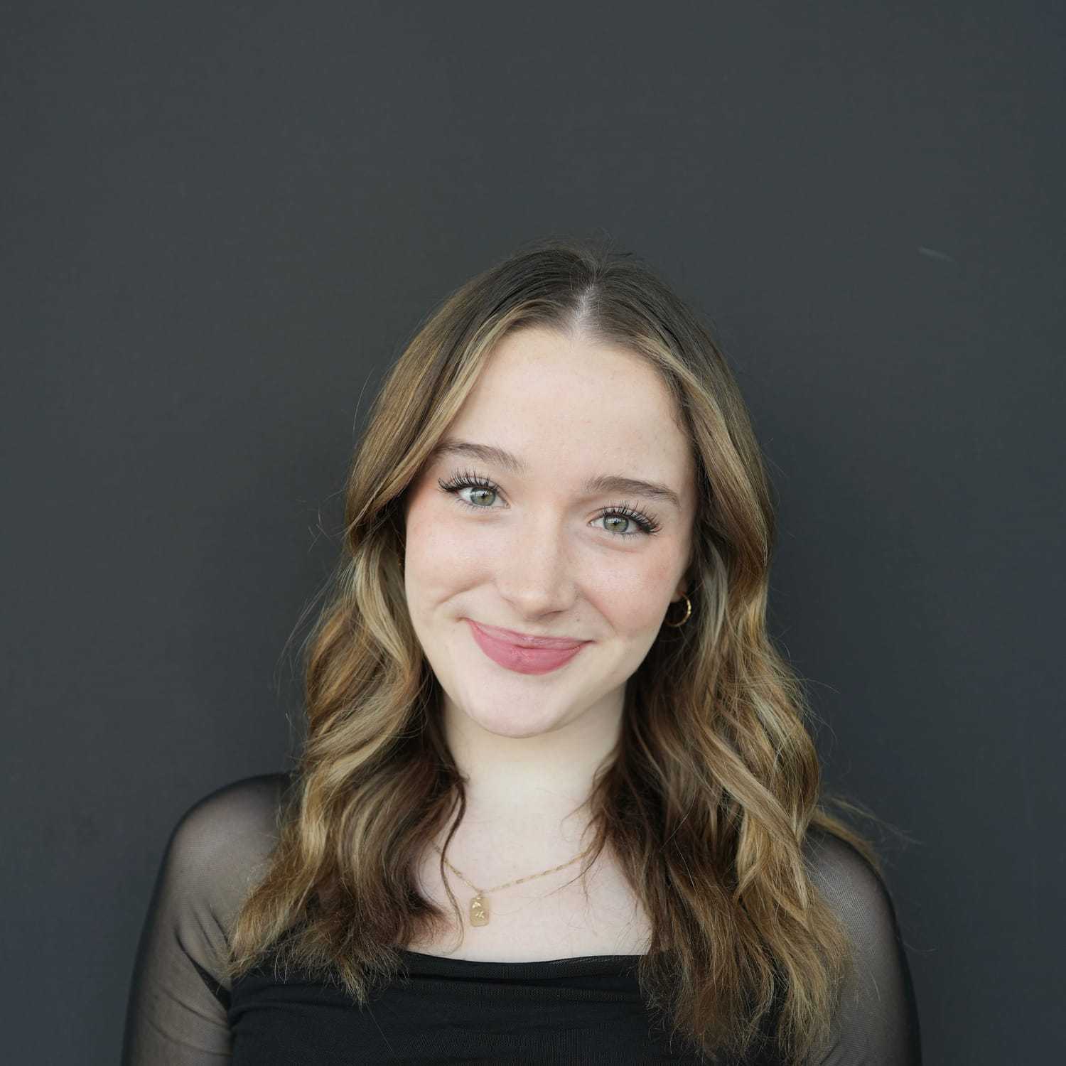 Portrait of Laney, a professional stylist at Frank Gironda  Salons, showcasing their expertise and style.