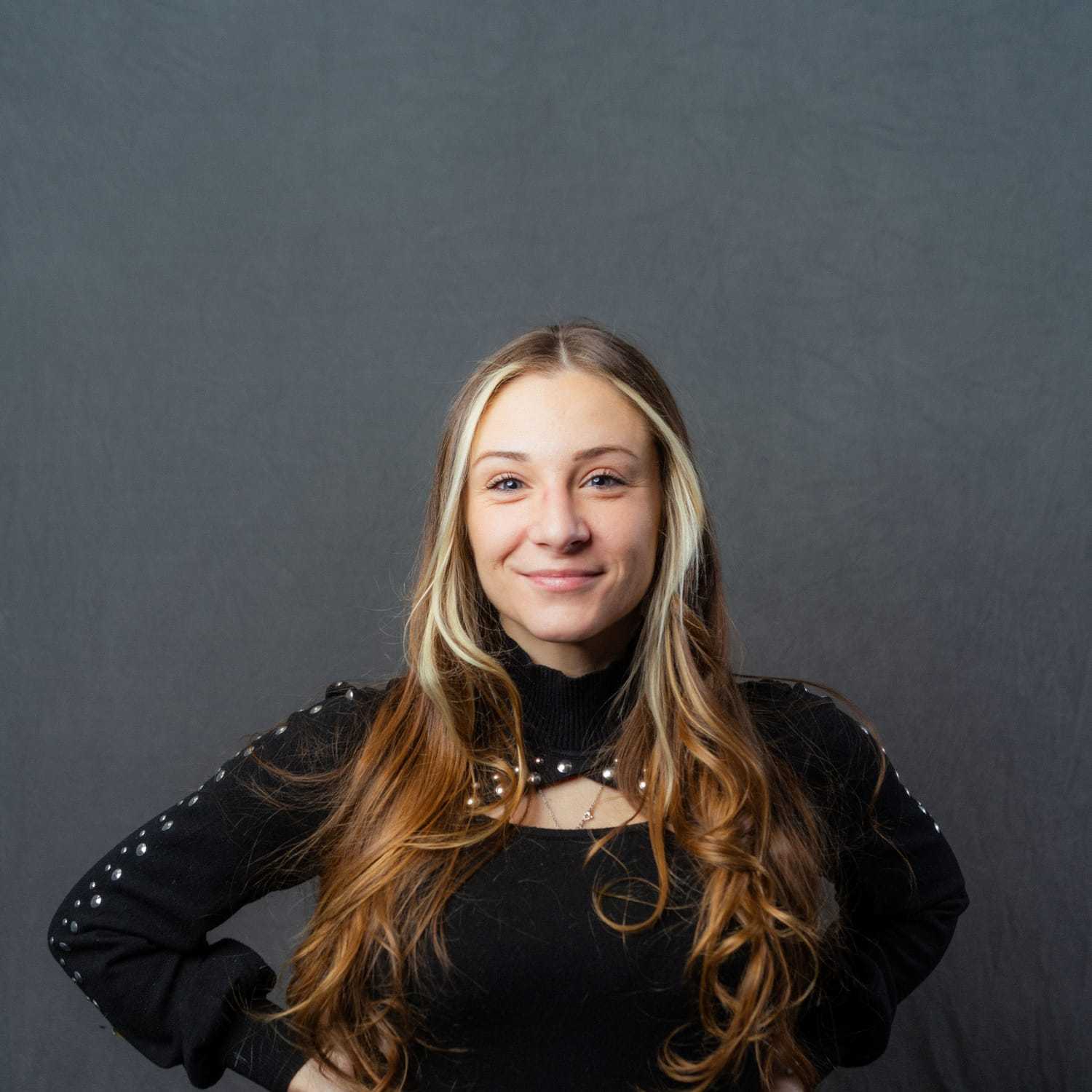 Portrait of Erica, a professional stylist at Frank Gironda  Salons, showcasing their expertise and style.