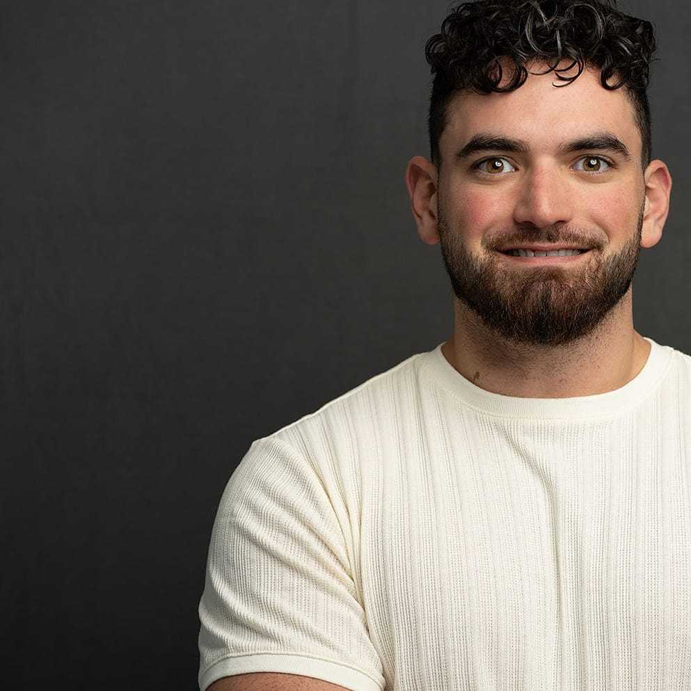 Portrait of Jamison, a professional stylist at Frank Gironda  Salons, showcasing their expertise and style.