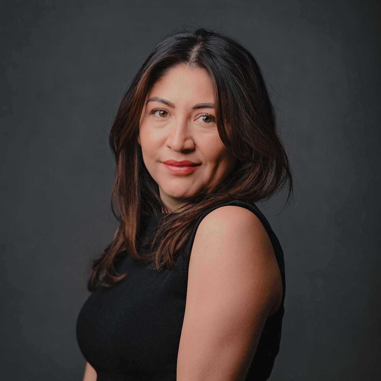 Portrait of Perla, a professional stylist at Frank Gironda  Salons, showcasing their expertise and style.