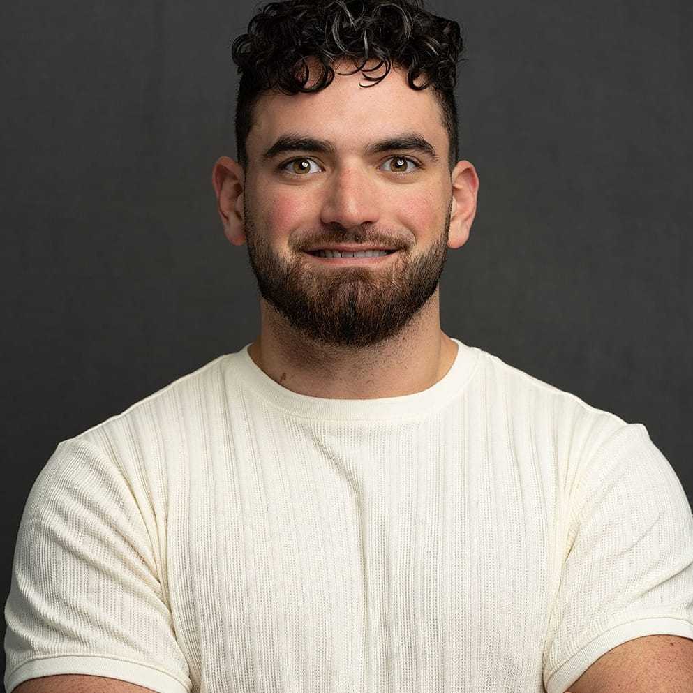 Portrait of Jamison, a professional stylist at Frank Gironda  Salons, showcasing their expertise and style.