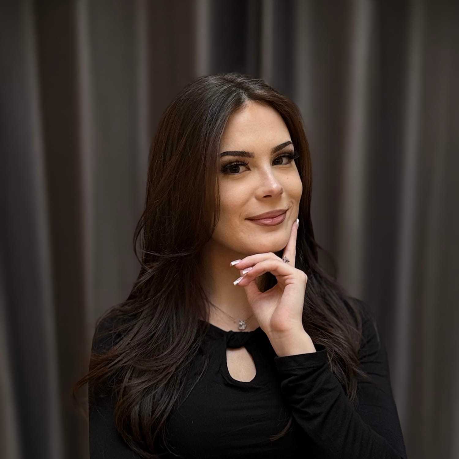 Portrait of Megan, a professional stylist at Frank Gironda Salons, showcasing their expertise and style.