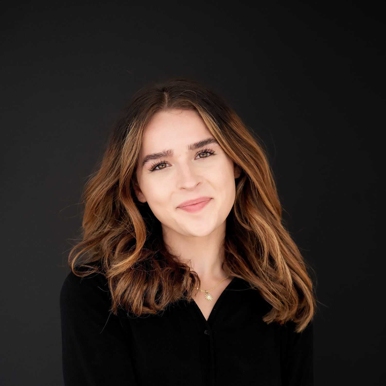 Portrait of Cara, a professional stylist at Frank Gironda  Salons, showcasing their expertise and style.