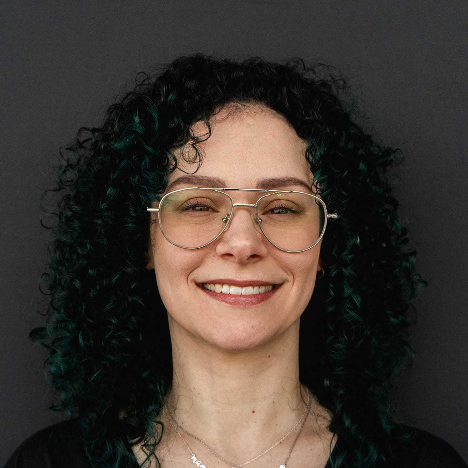 Portrait of Paige, a professional stylist at Frank Gironda  Salons, showcasing their expertise and style.