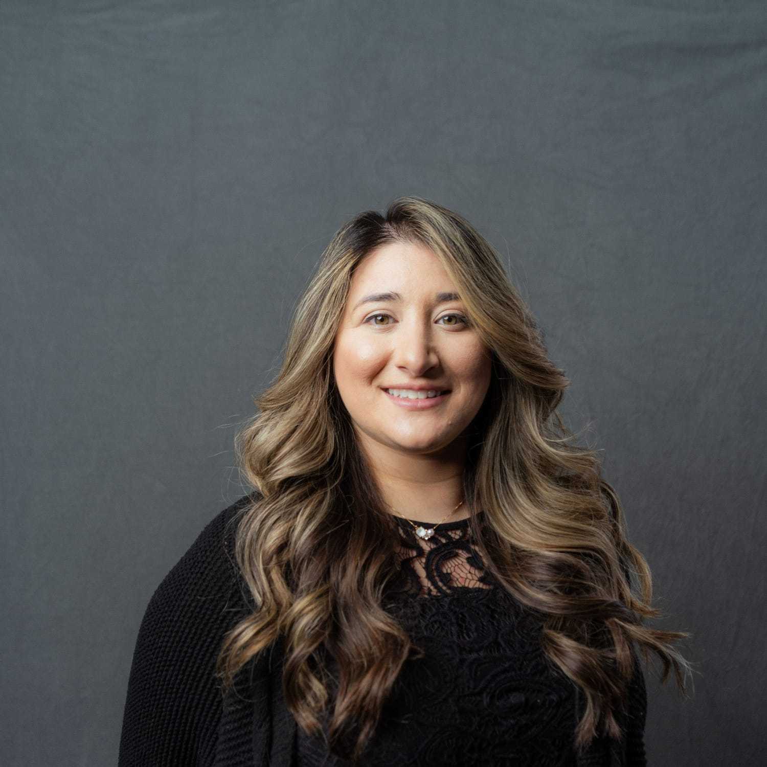 Portrait of Eliana, a professional stylist at Frank Gironda  Salons, showcasing their expertise and style.