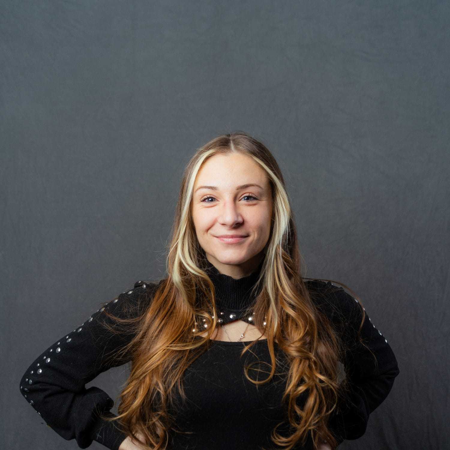 Portrait of Erica, a professional stylist at Frank Gironda  Salons, showcasing their expertise and style.