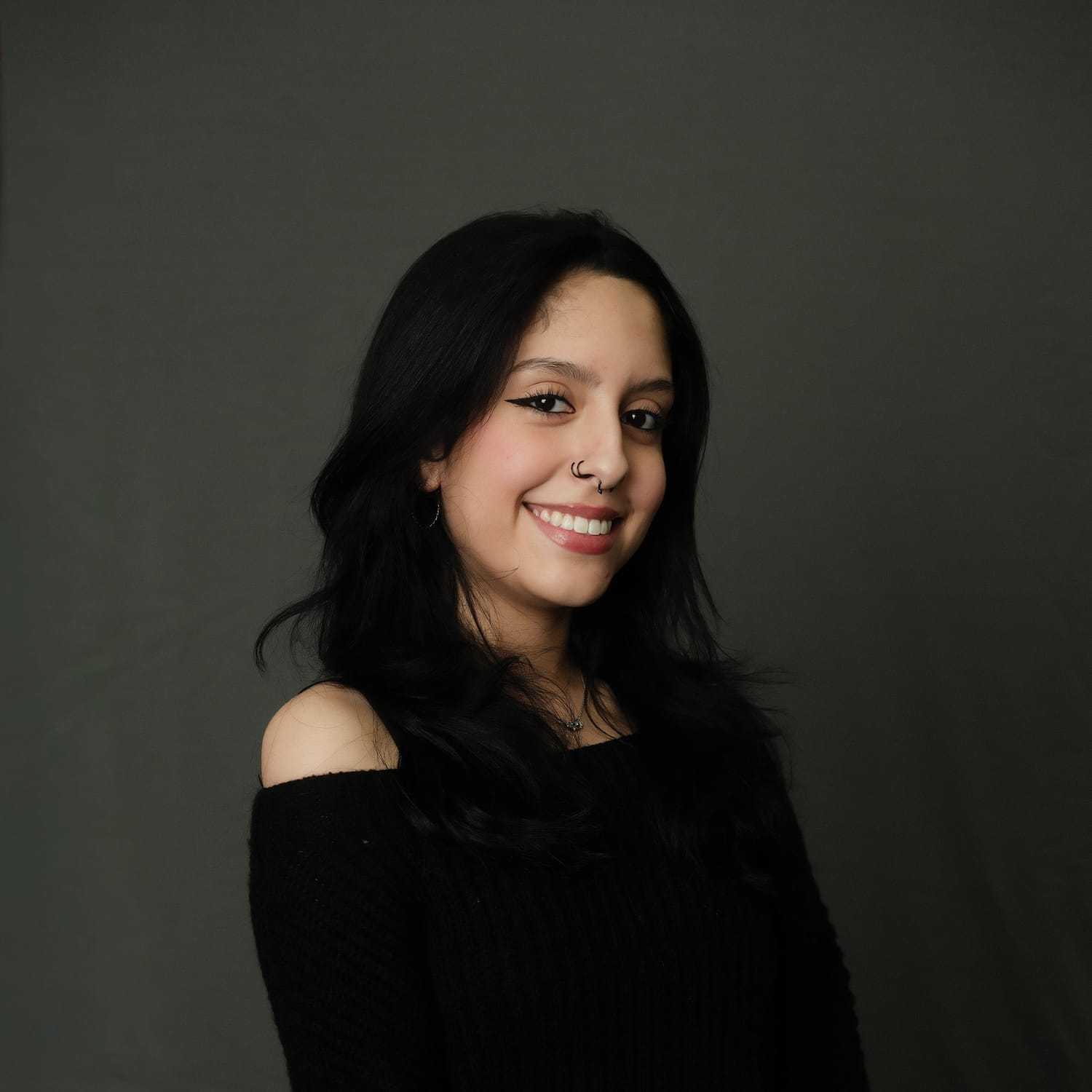 Portrait of Delicia, a professional stylist at Frank Gironda  Salons, showcasing their expertise and style.
