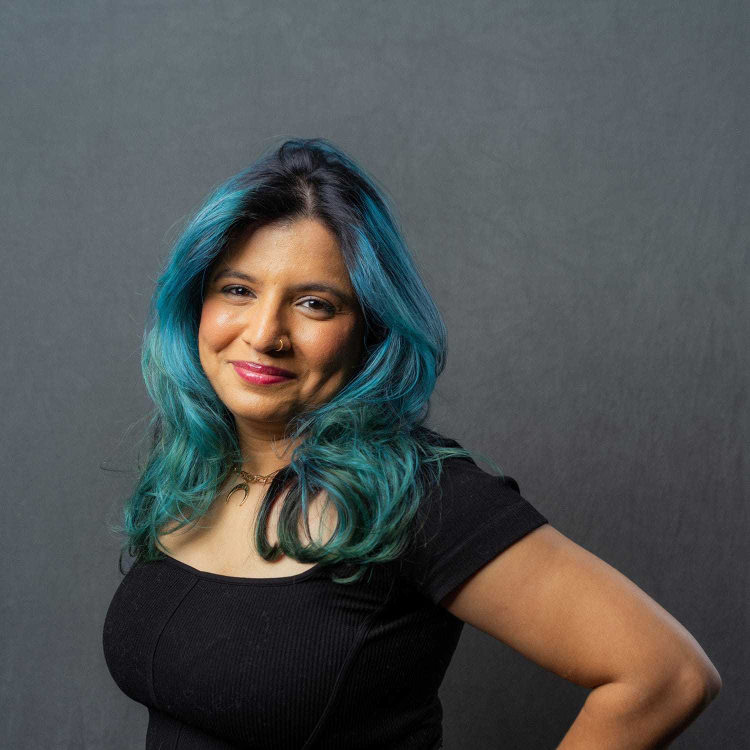 Portrait of Urooj, a professional stylist at Frank Gironda Salons, showcasing their expertise and style.