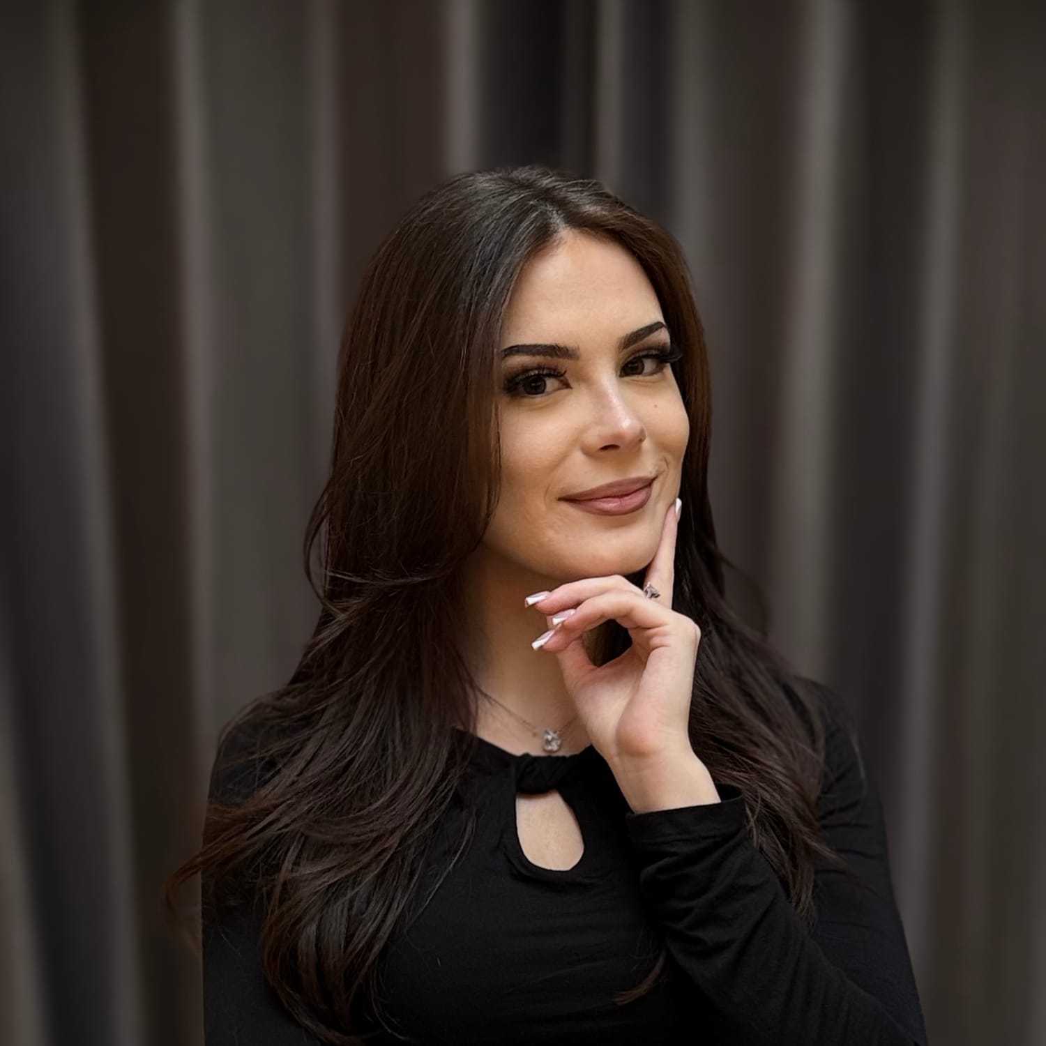Portrait of Megan, a professional stylist at Frank Gironda Salons, showcasing their expertise and style.