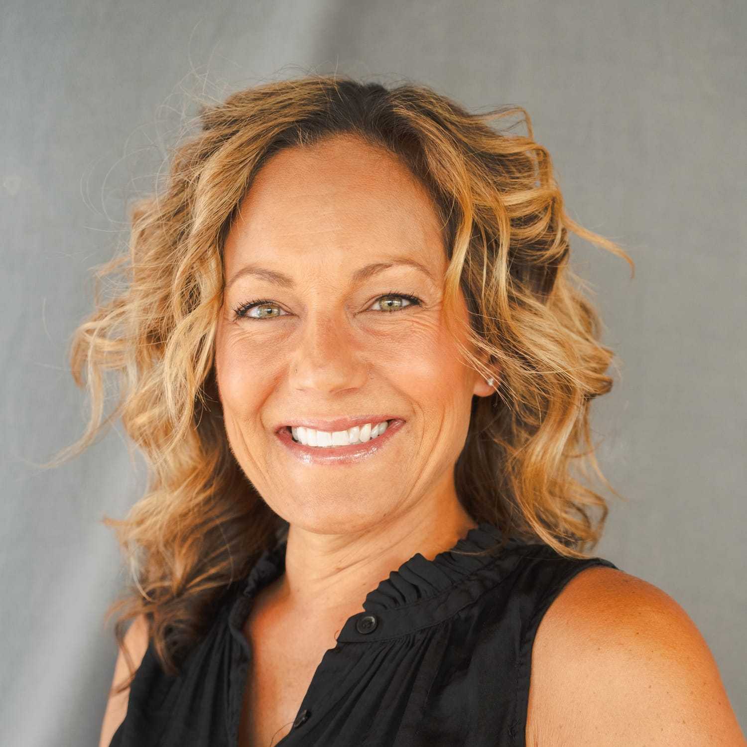 Portrait of Rica, a professional stylist at Frank Gironda  Salons, showcasing their expertise and style.