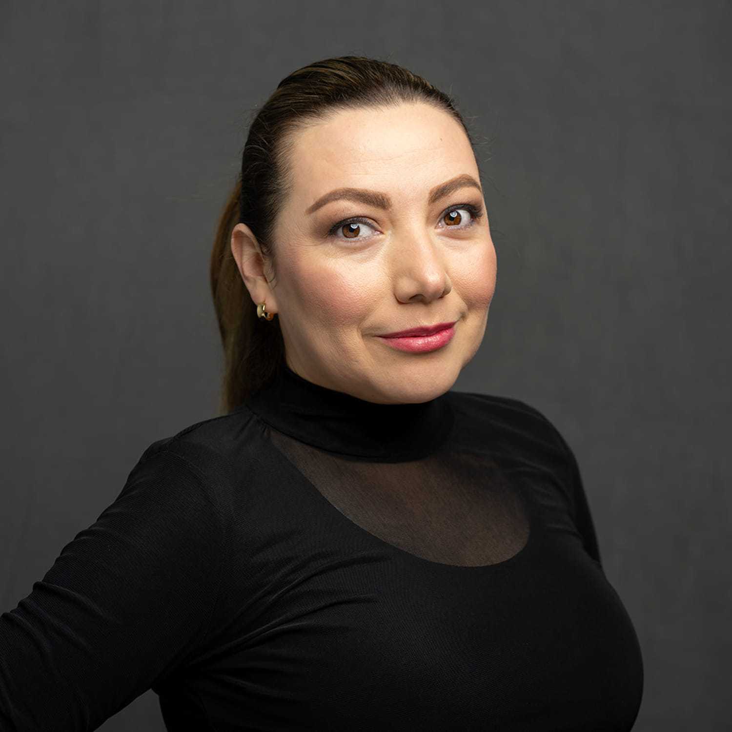 Portrait of Fernanda, a professional stylist at Frank Gironda  Salons, showcasing their expertise and style.