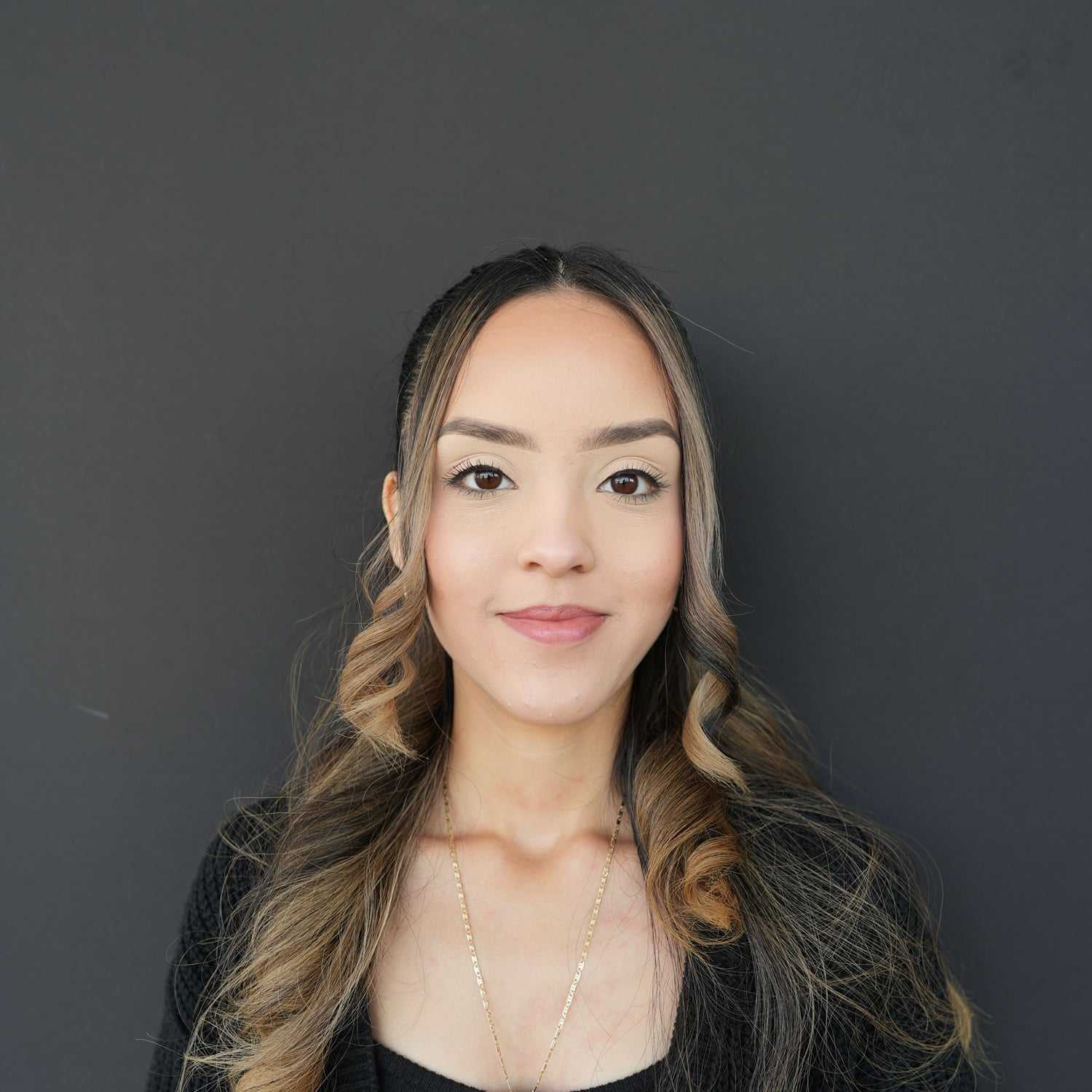 Portrait of Jannely, a professional stylist at Frank Gironda Salons, showcasing their expertise and style.