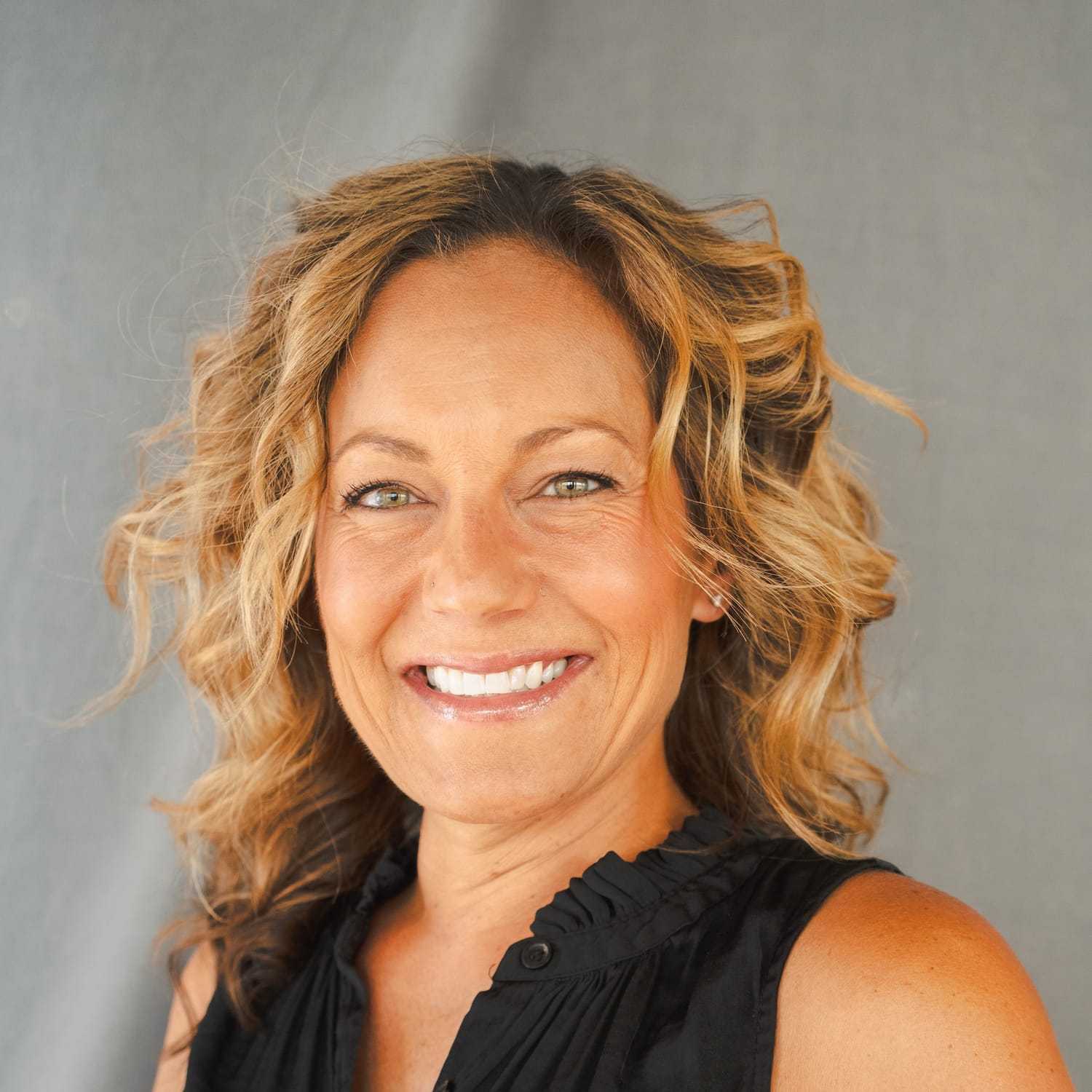 Portrait of Rica, a professional stylist at Frank Gironda  Salons, showcasing their expertise and style.