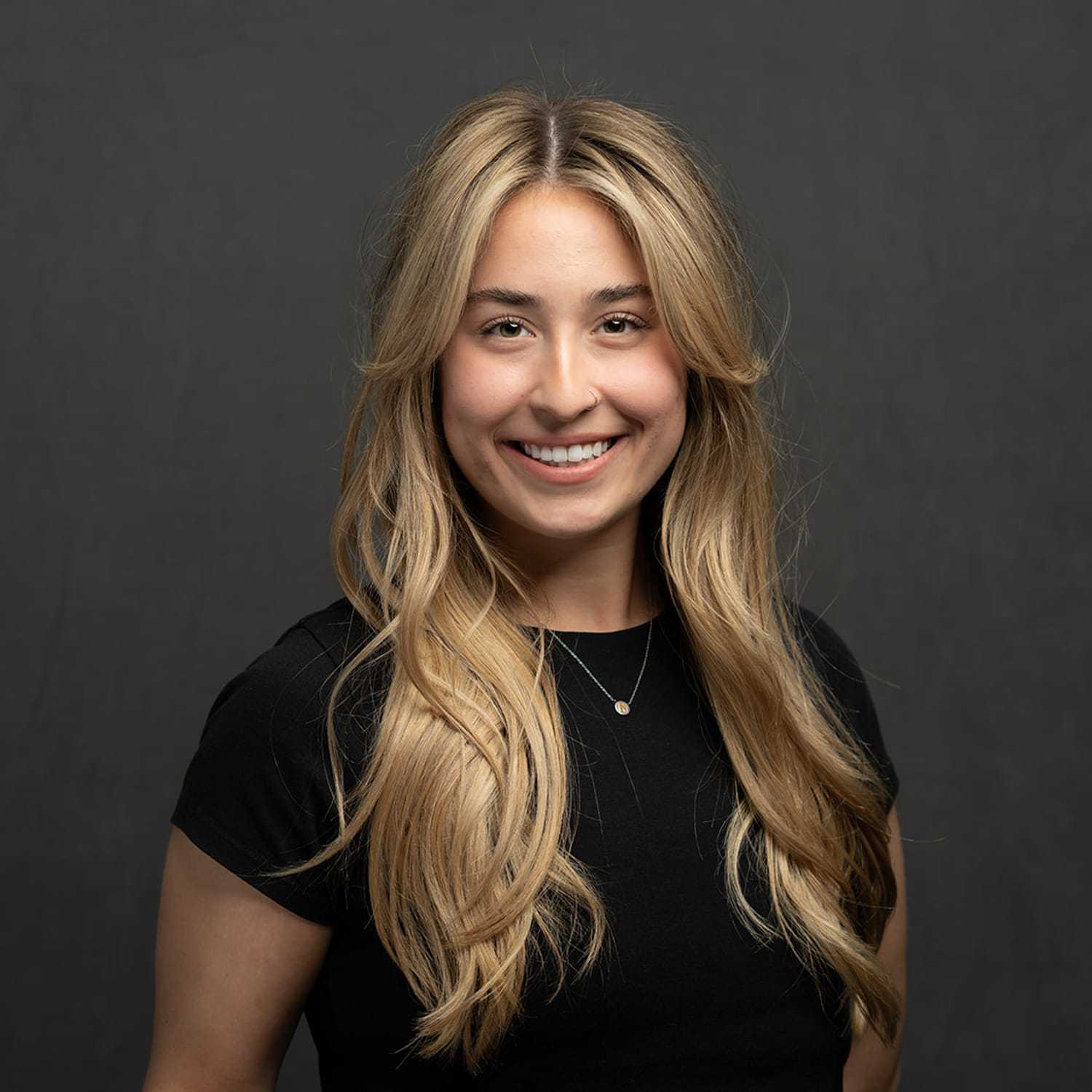 Portrait of Natalie, a professional stylist at Frank Gironda  Salons, showcasing their expertise and style.