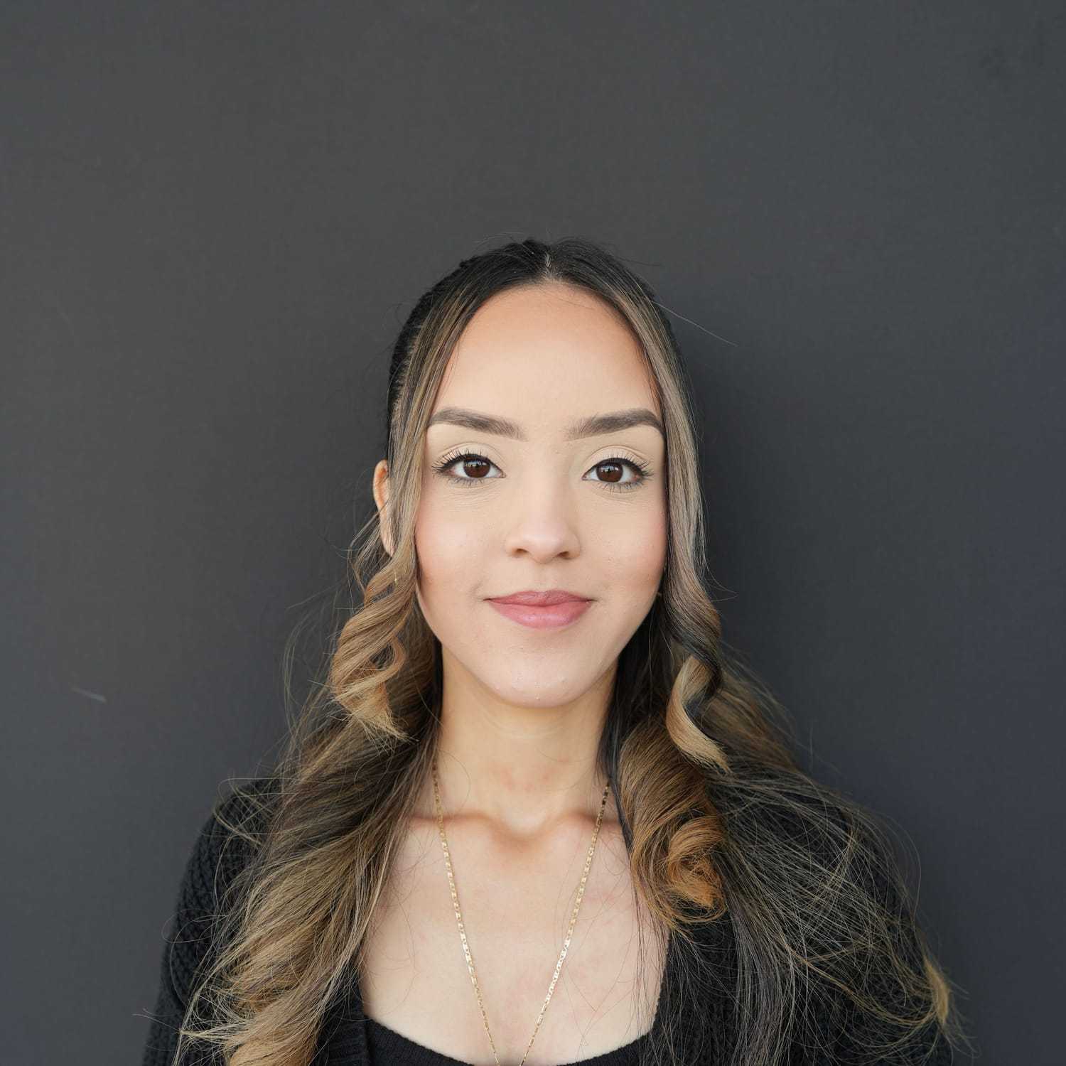 Portrait of Jannely, a professional stylist at Frank Gironda  Salons, showcasing their expertise and style.